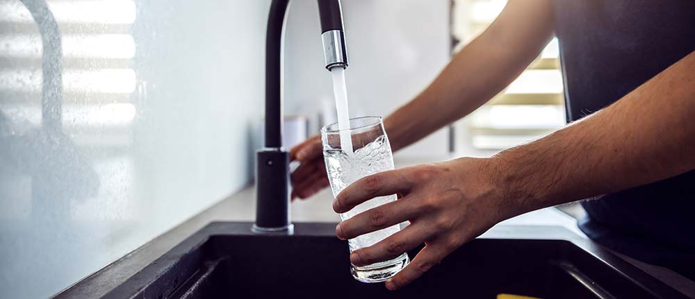 Filling glass at sink